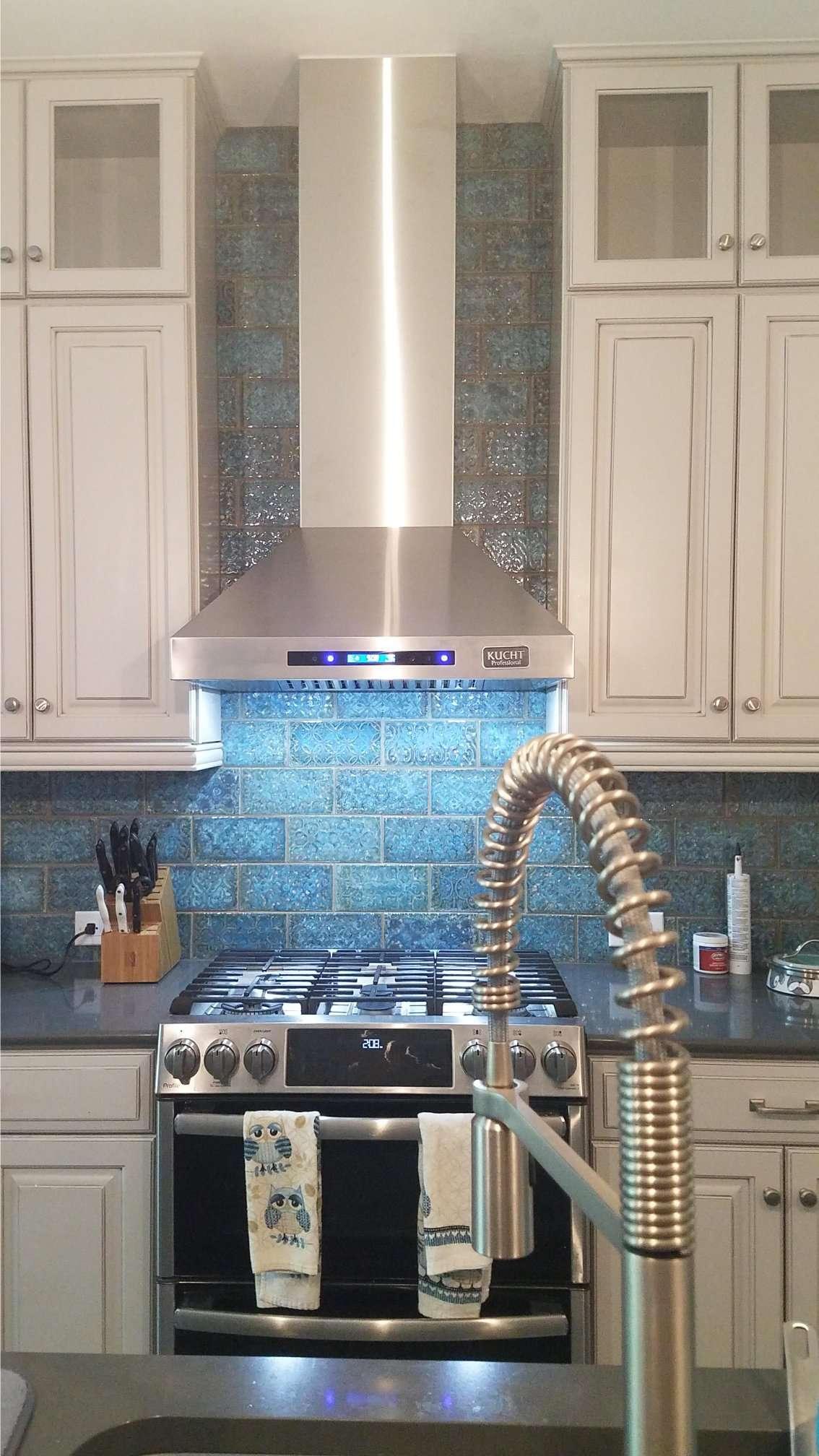 Custom kitchen installation Naples FL — range hood and cabinetry by 6M Design